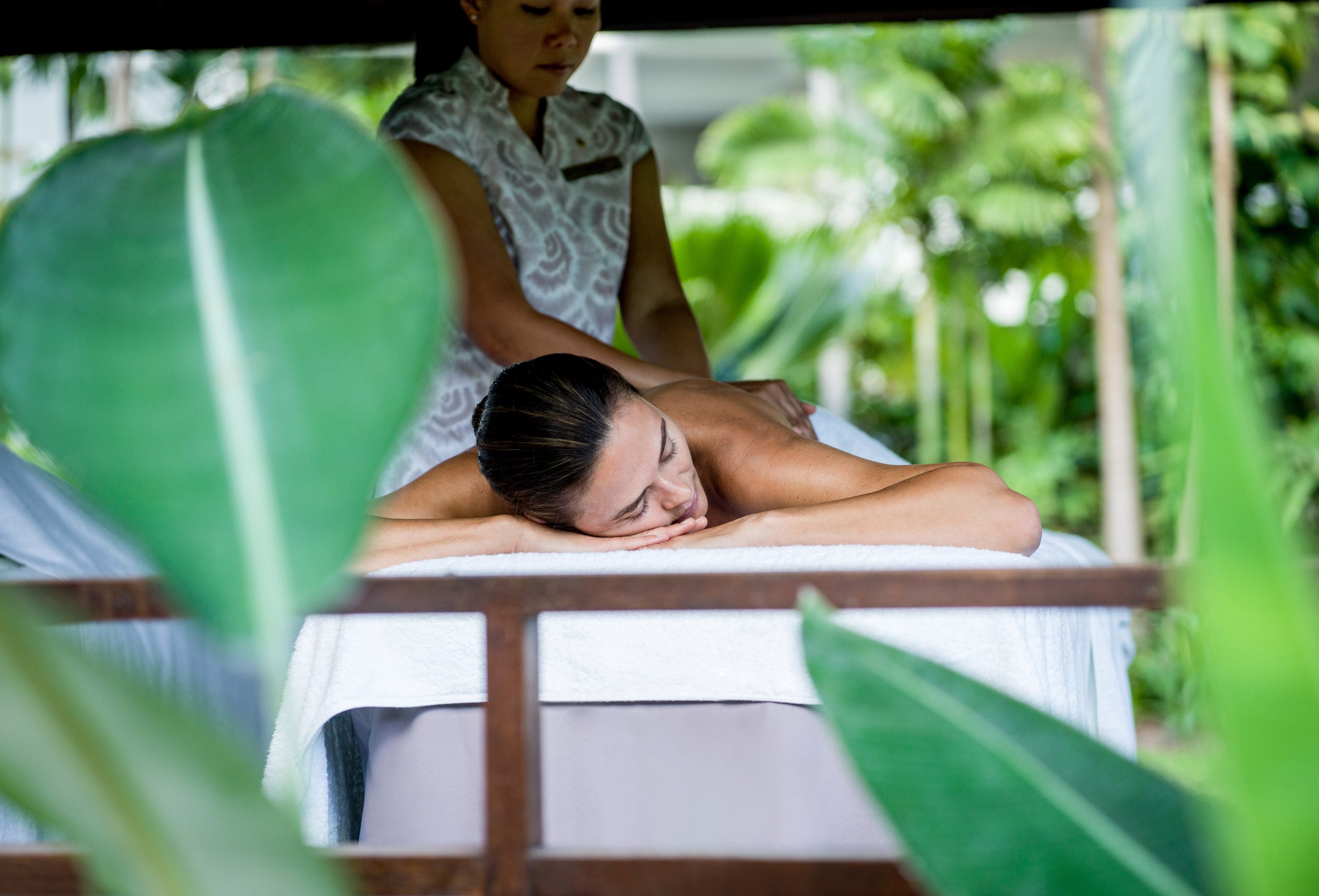 a woman lying on a massage table